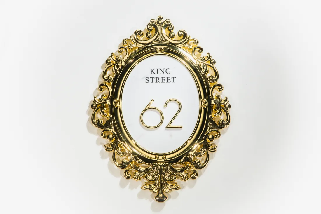 Oval gold baroque frame street plaque KING STREET 62