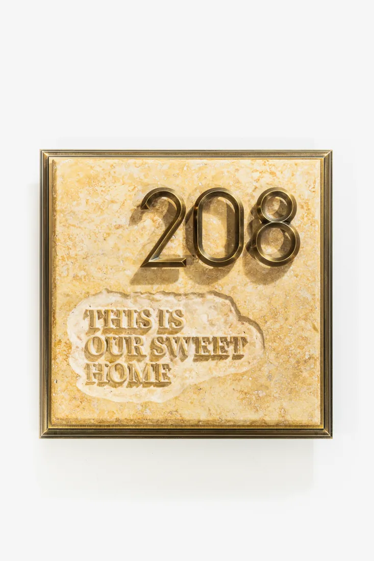 Travertine stone address plaque with raised brass numbers 208