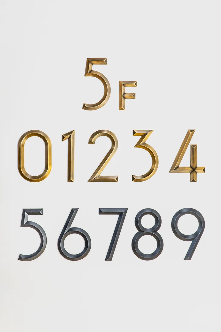 Brushed gold and black beveled serif metal numerals
