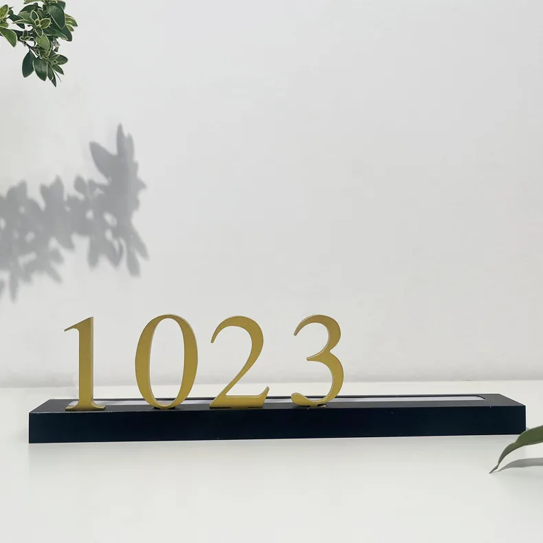 H008-1 brushed gold aluminum numerals 1023 on a black backlit bar