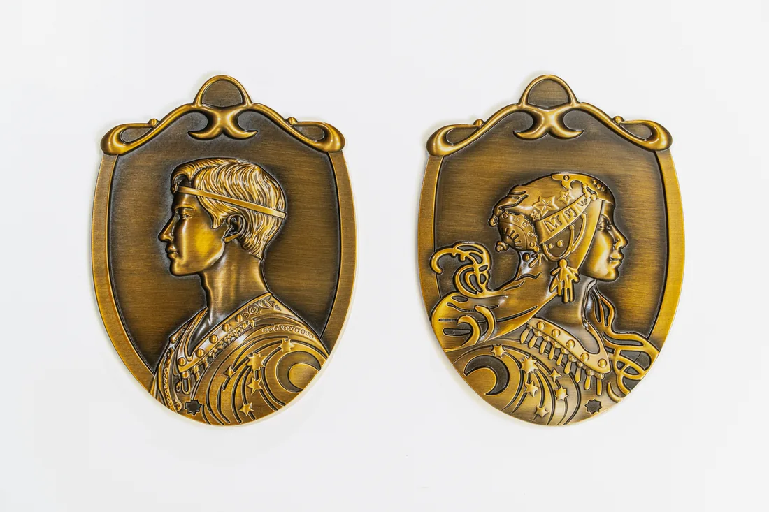 Antique brass shield restroom plaques with relief king and queen portraits