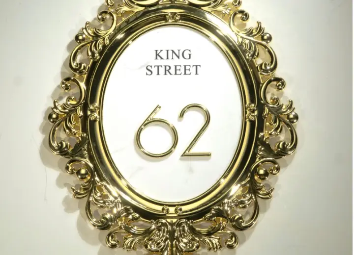 Exterior address plaque with raised decorative numbers